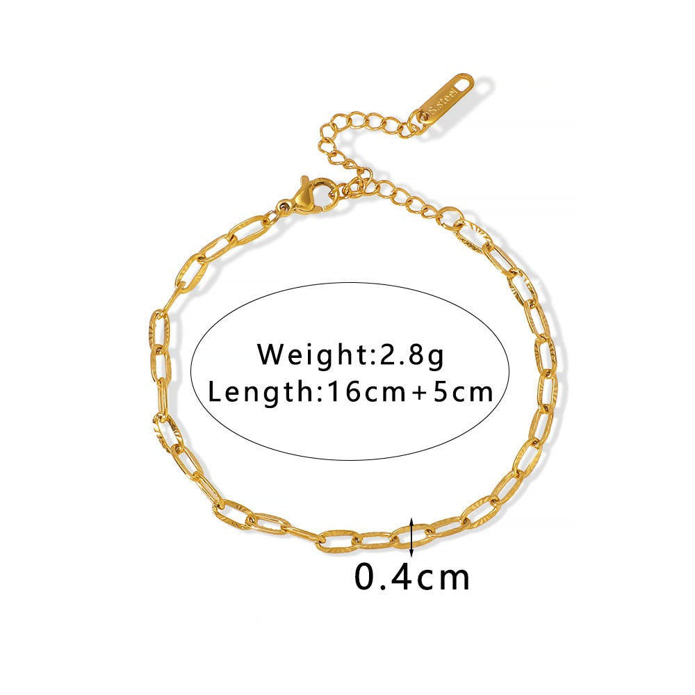 Gold chain bracelet with measurements on a white background