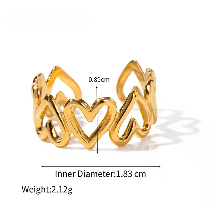 Gold heart-shaped ring with measurements on a white background