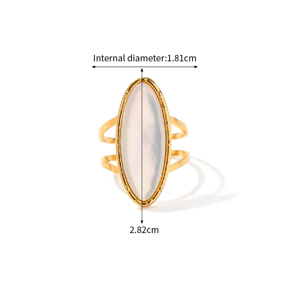 Gold ring with a white stone, showing measurements on a white background
