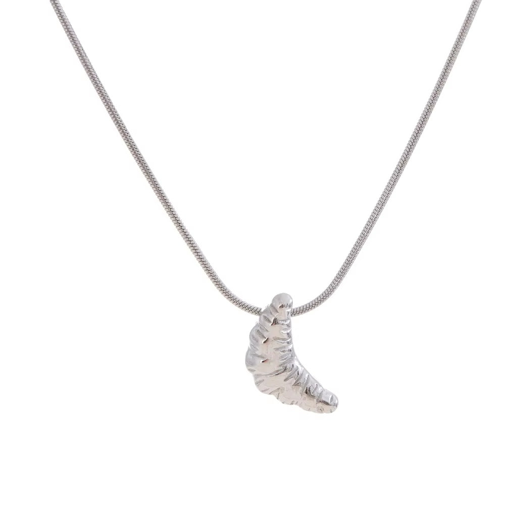 Silver croissant necklace on a white background