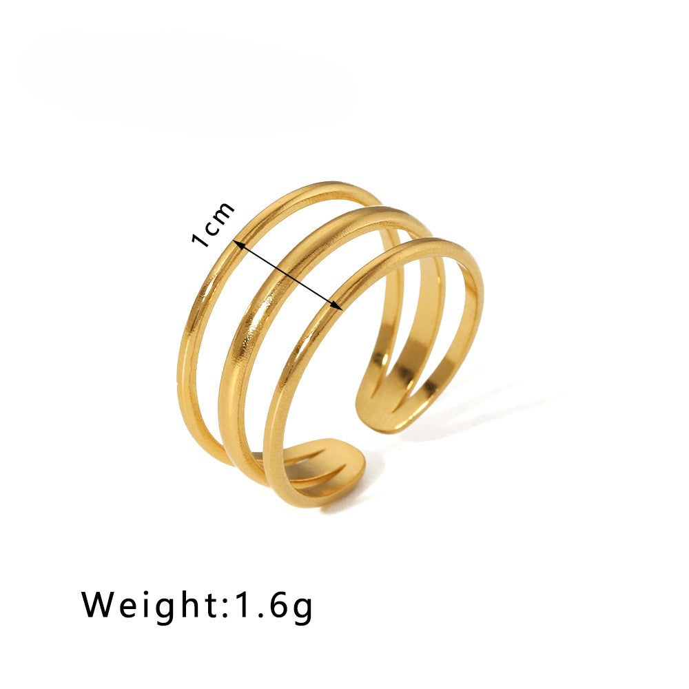 waterproof gold ring with triple design on a white background with measurements