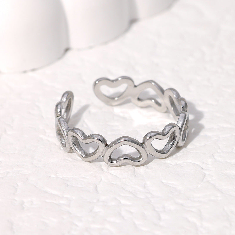 elegant silver ring with heart pattern