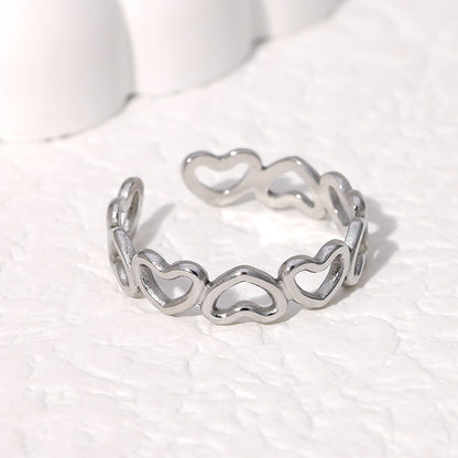 elegant silver ring with heart pattern