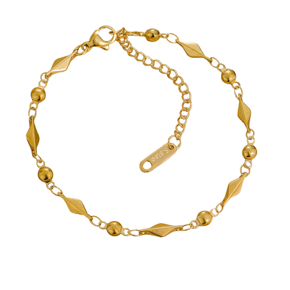 Gold bracelet with geometric designs on a white background
