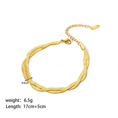 Gold bracelet with measurement details on a white background