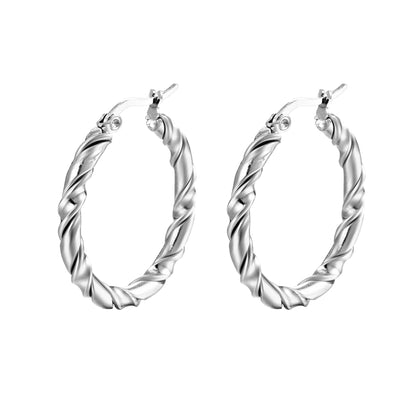 Pair of silver hoop earrings on a white background