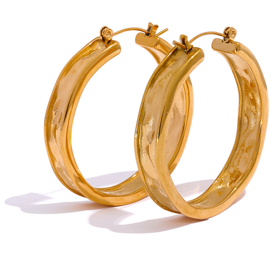 gold statement hoops on white background