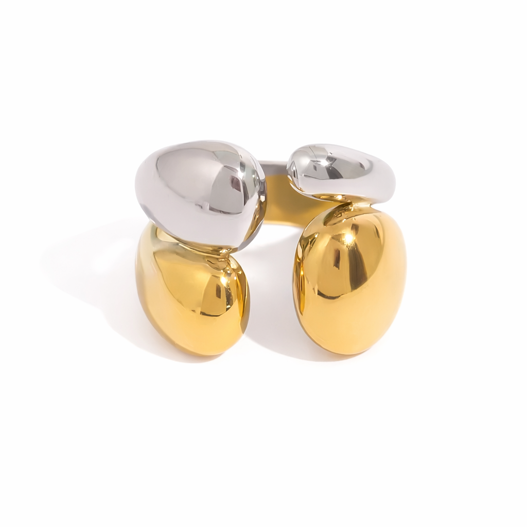 Two-tone gold and silver ring on a white background