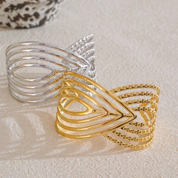 two stainless steel bangles in silver and gold