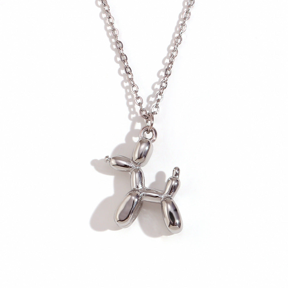 Silver stainless steel dog-shaped pendant on a chain against a white background