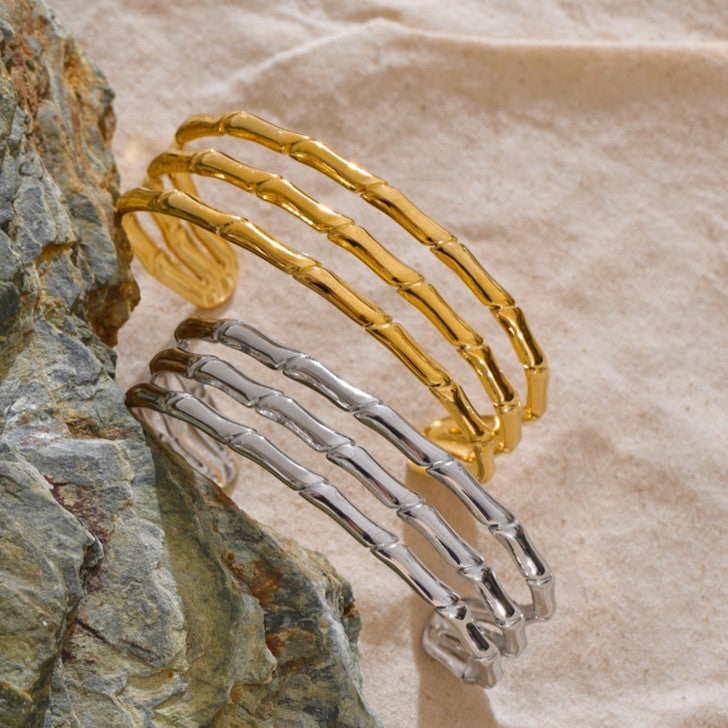 stainless steel statement bangles in gold and silver