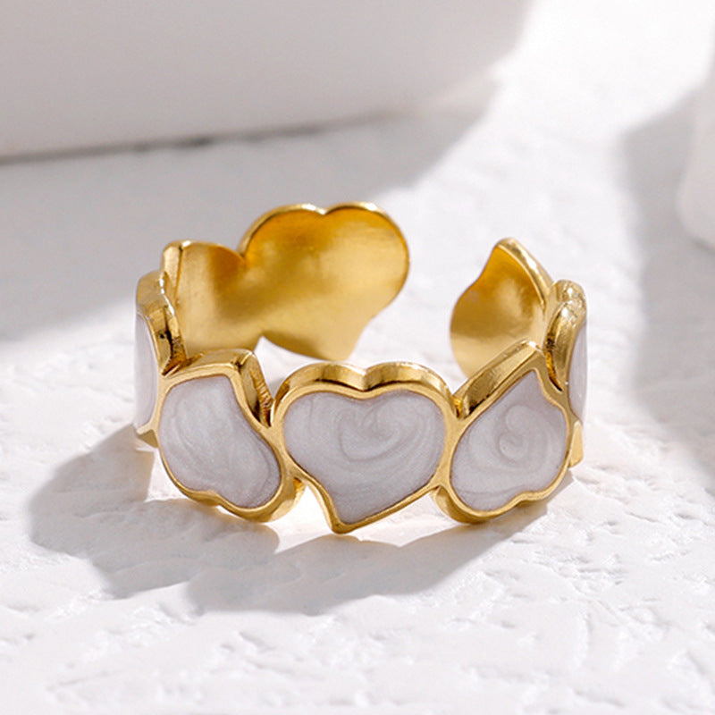 gold stainless steel ring with white hearts