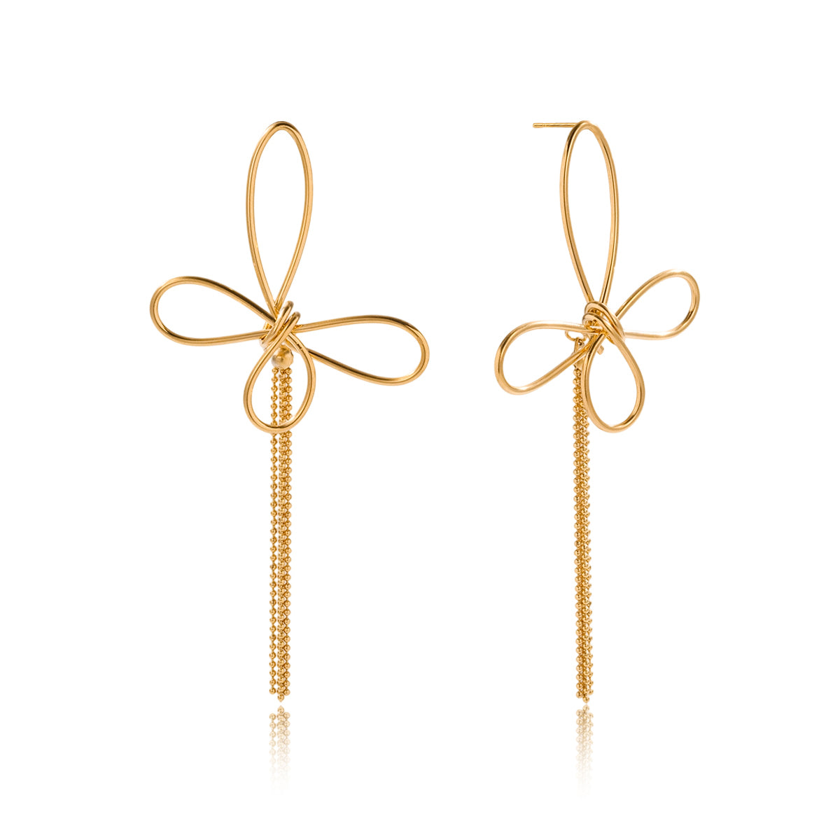 Gold bow-shaped earrings on a white background