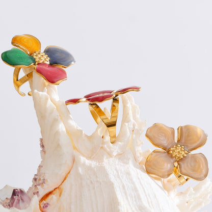 Colorful flower-shaped rings on a white background