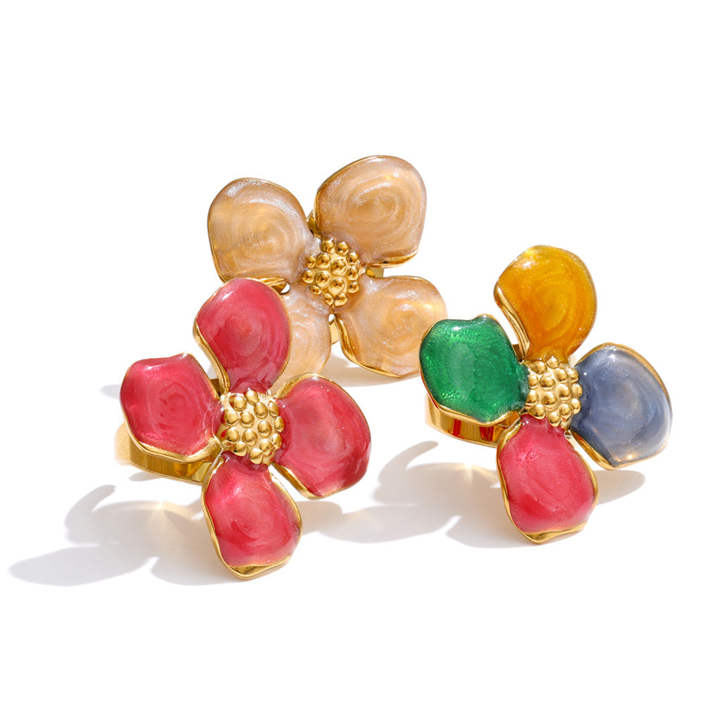 Colorful flower-shaped rings on a white background