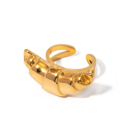 Gold croissant ring on a white background