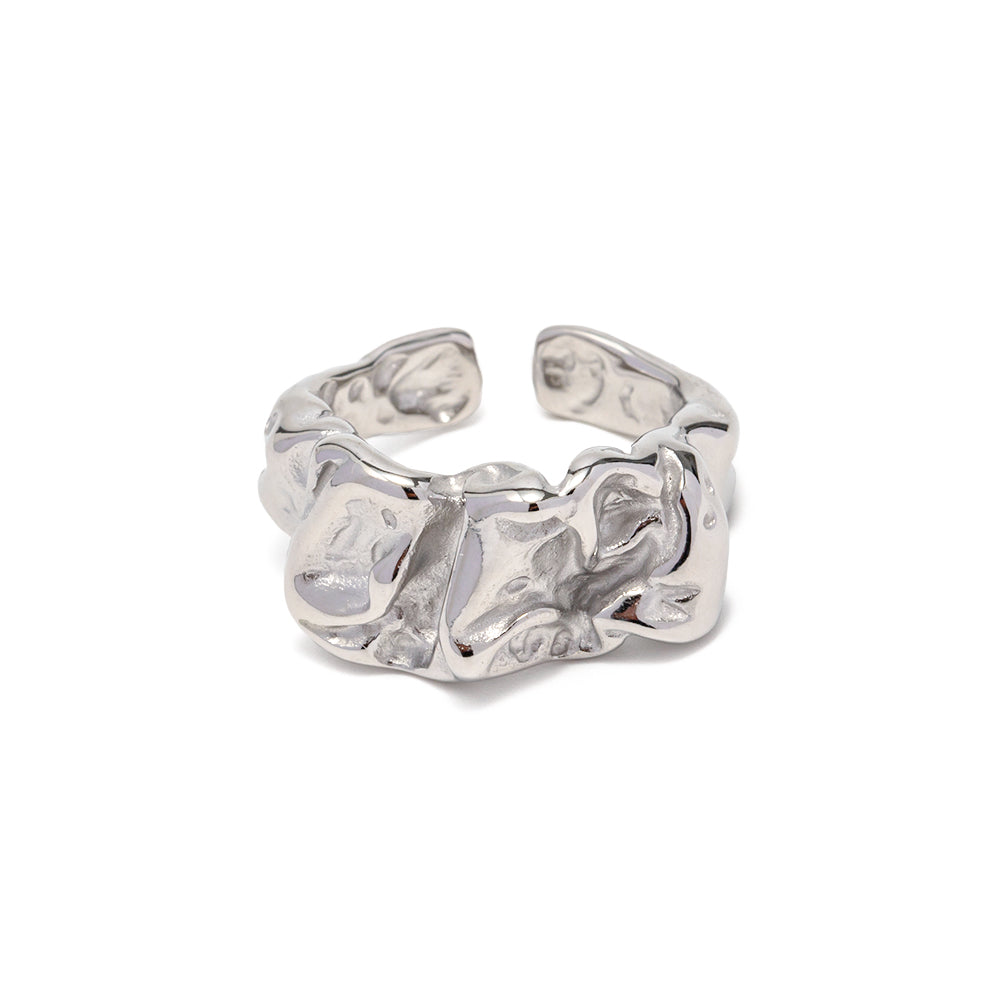 Silver chunky ring with a textured design on a white background