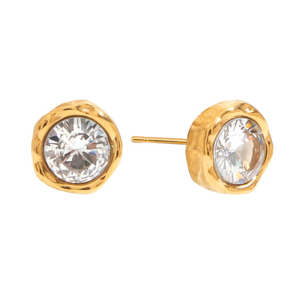 Gold stud earrings with clear gemstones on a white background