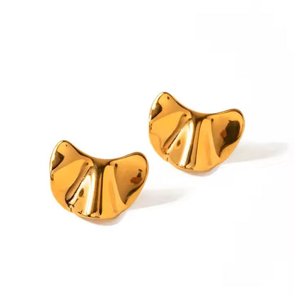 Gold croissant-shaped earrings on a white background