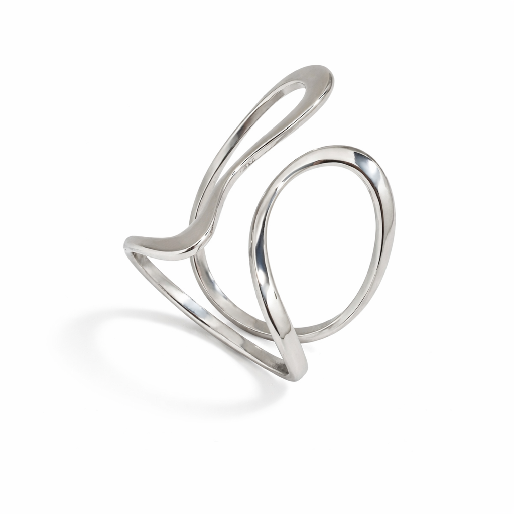 Silver statement ring with a modern design on a white background