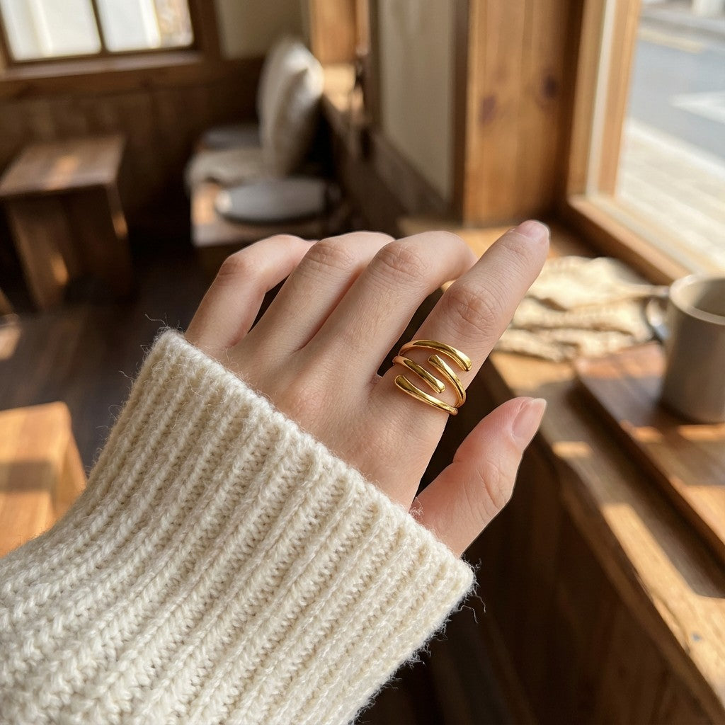 a person wearing gold stainless steel ring