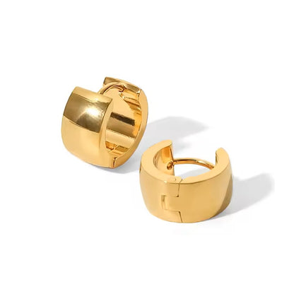 Gold hoop earrings on a white background