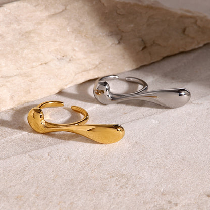 two chunky double rings, one in gold, another in silver color