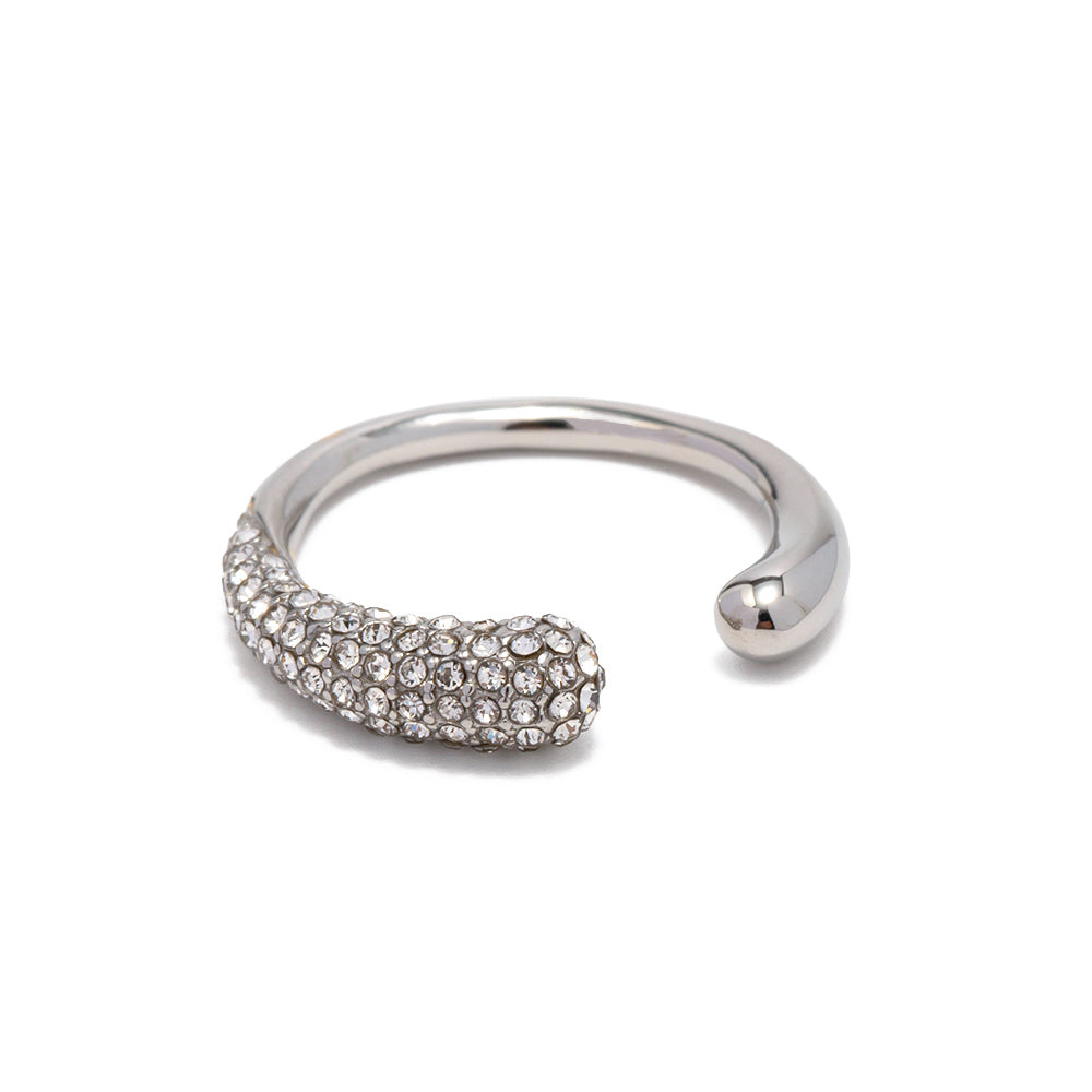 Silver ring with embedded stones on a white background