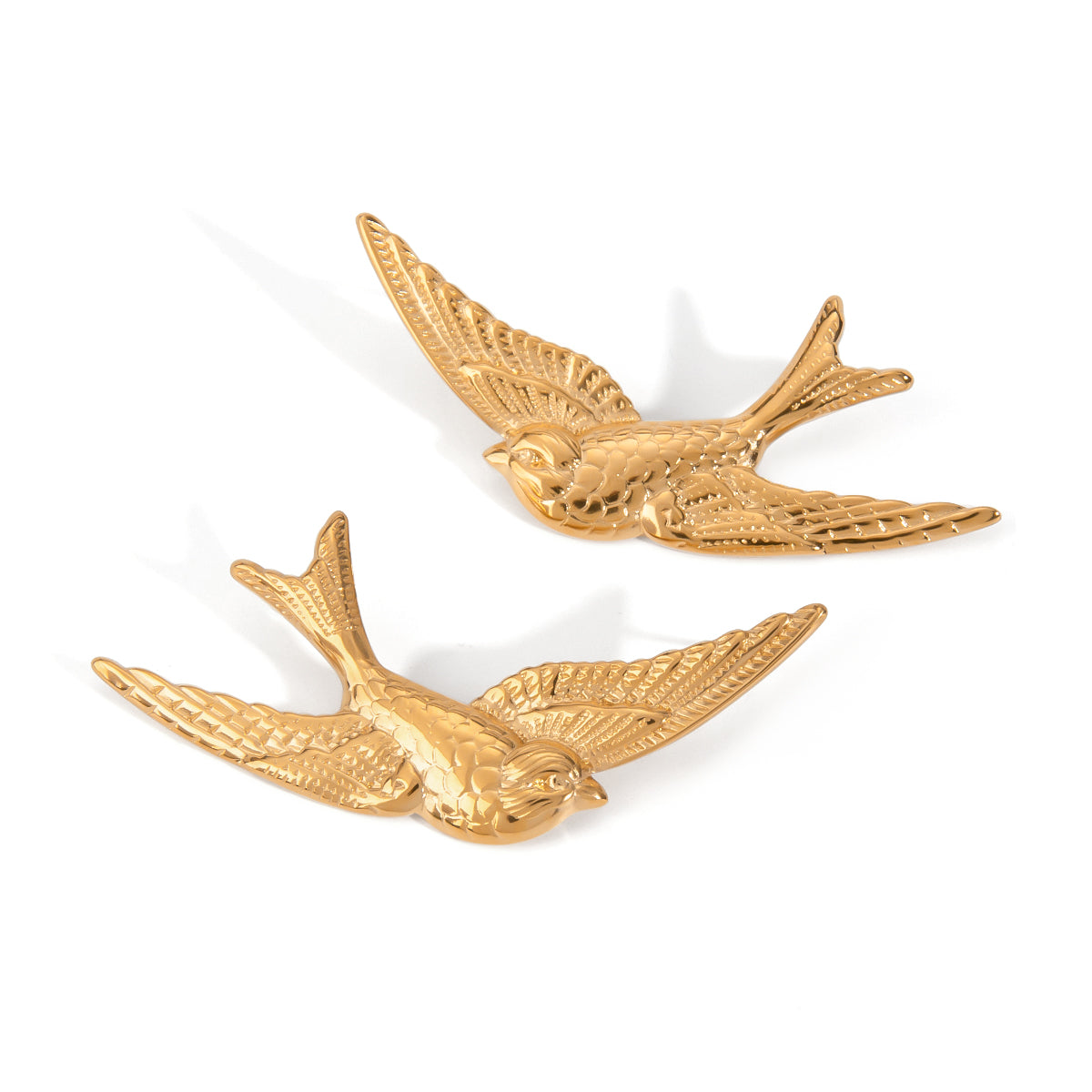 Two gold bird stainless steel earrings on a white background