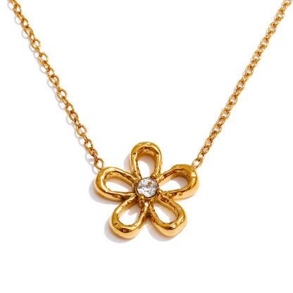 Gold necklace with a flower-shaped pendant on a white background