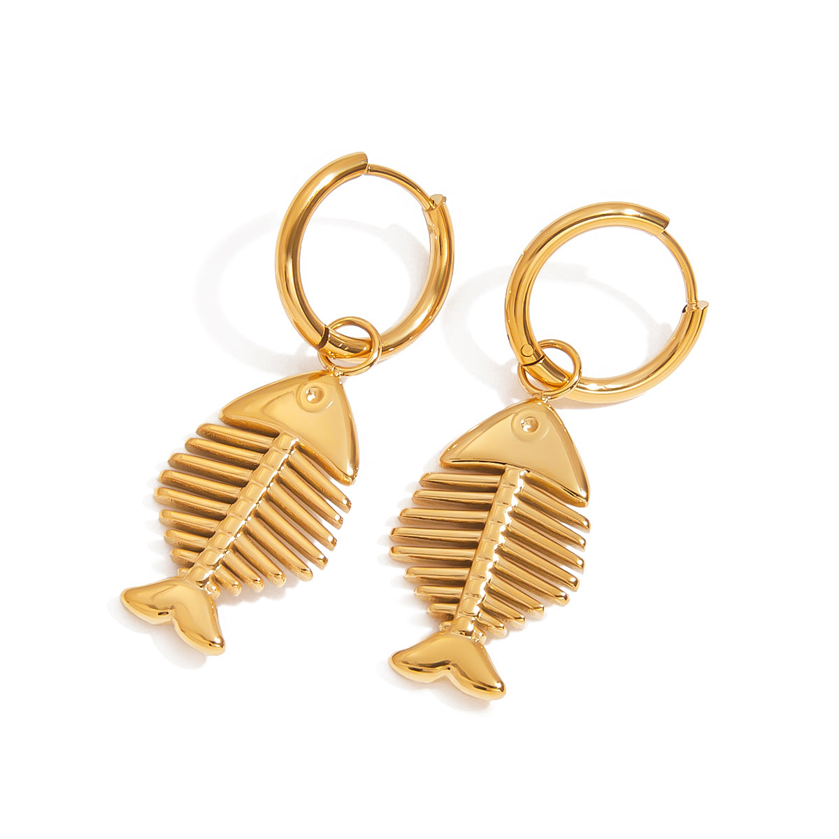 Gold fish bone-shaped earrings on a white background