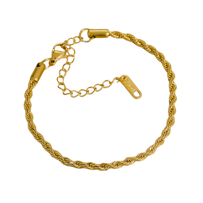 Gold stainless steel bracelet on a white background
