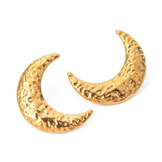 Gold crescent moon earrings on a white background