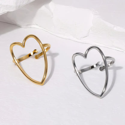 Gold and silver heart-shaped rings on a white background