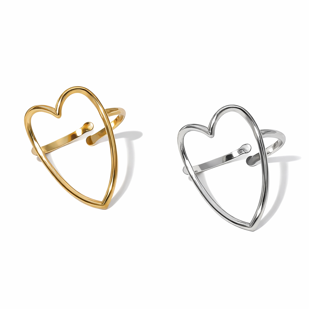 Gold and silver heart-shaped rings on a white background