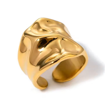 Gold chunky ring on a white background