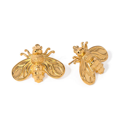 Gold bee-shaped earrings on a white background
