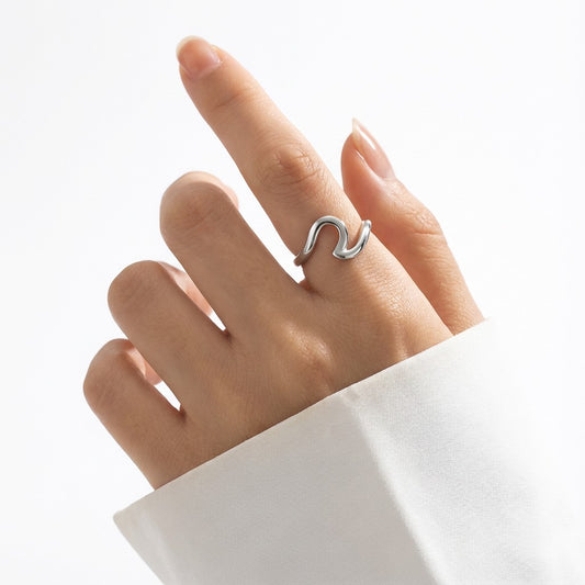 minimalist silver ring on a hand