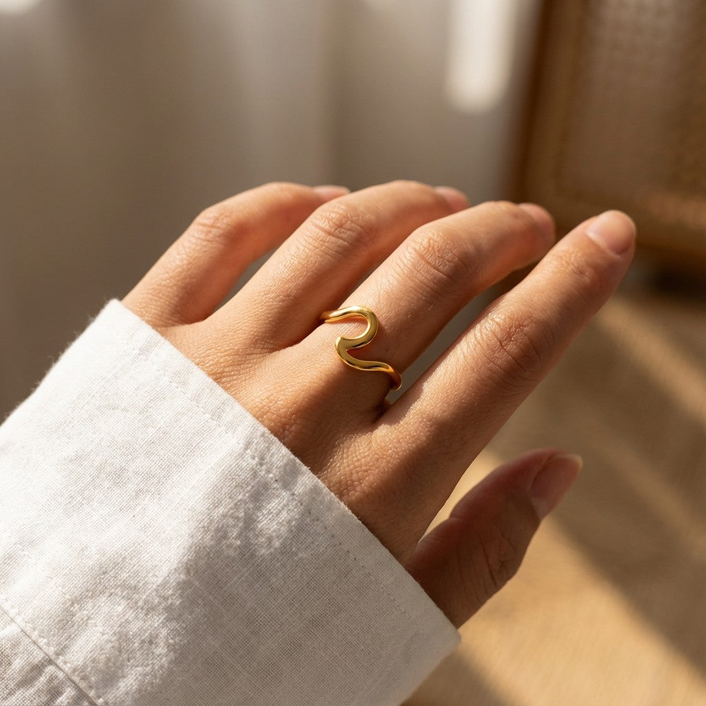 minimalist gold ring on hand
