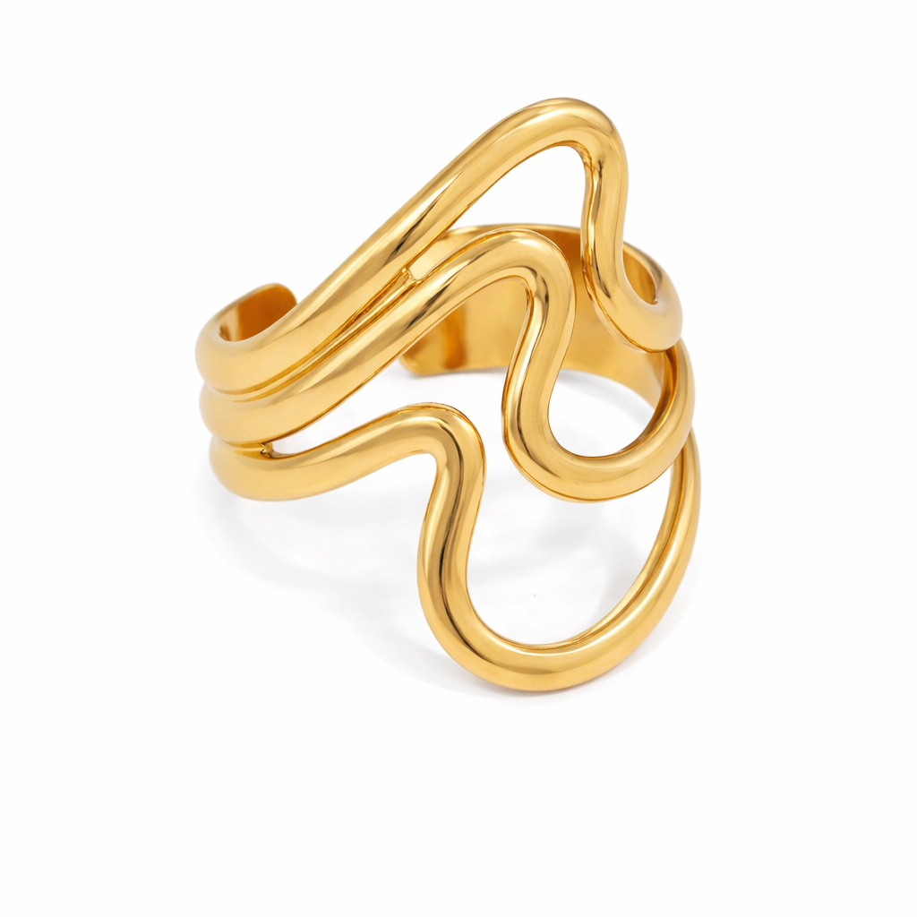 Gold spiral ring on a white background