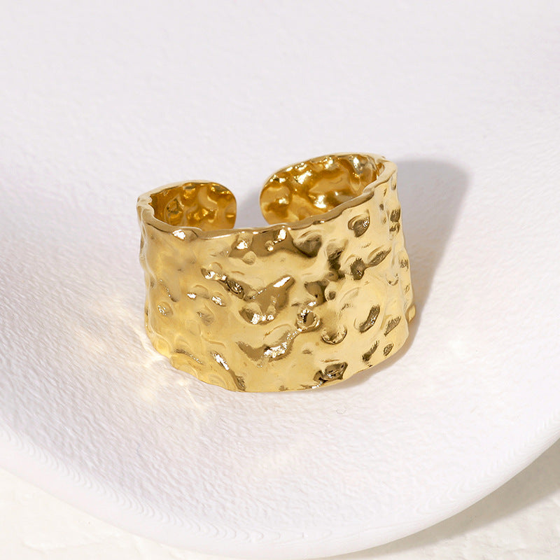 gold chunky ring on white background