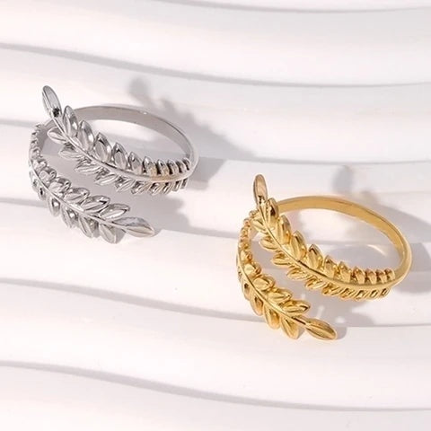 gold and silver leaf-shaped rings