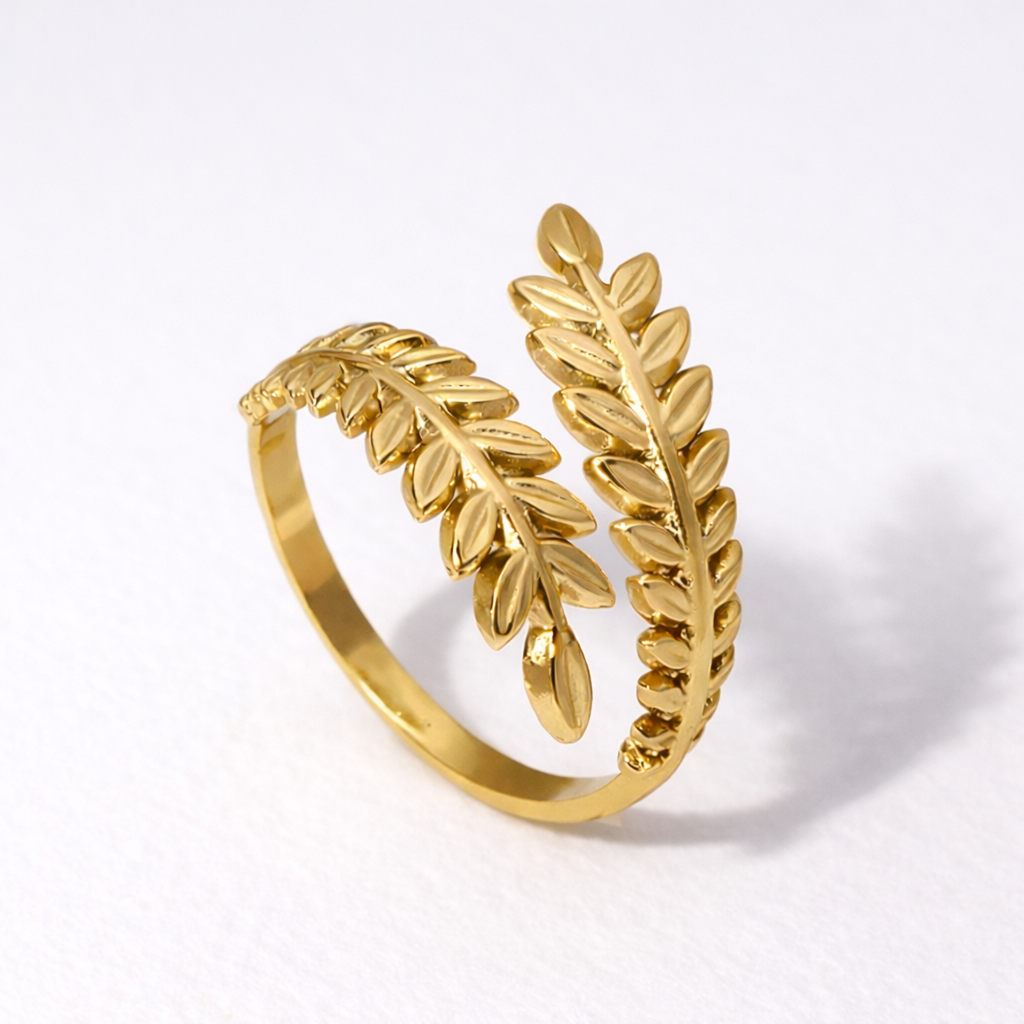 laurel-shaped gold waterproof ring on white background