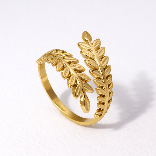 laurel-shaped gold waterproof ring on white background