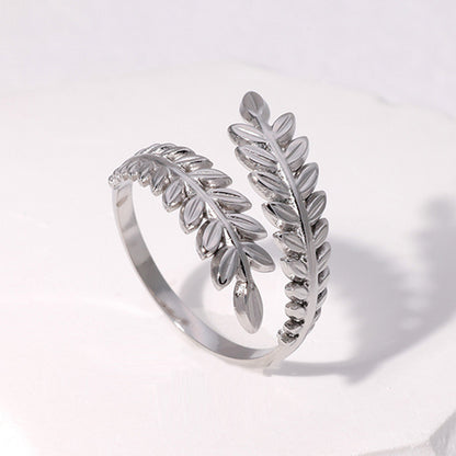 silver leaf-shaped ring on white background