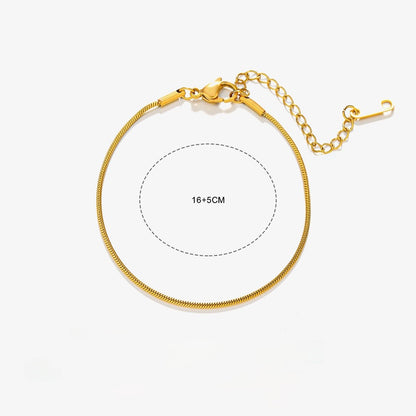 Gold bracelet on a white background with measurement details.