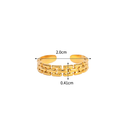 Gold ring with measurements on a white background
