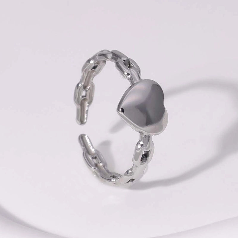 silver tarnish-free heartshaped ring on white background
