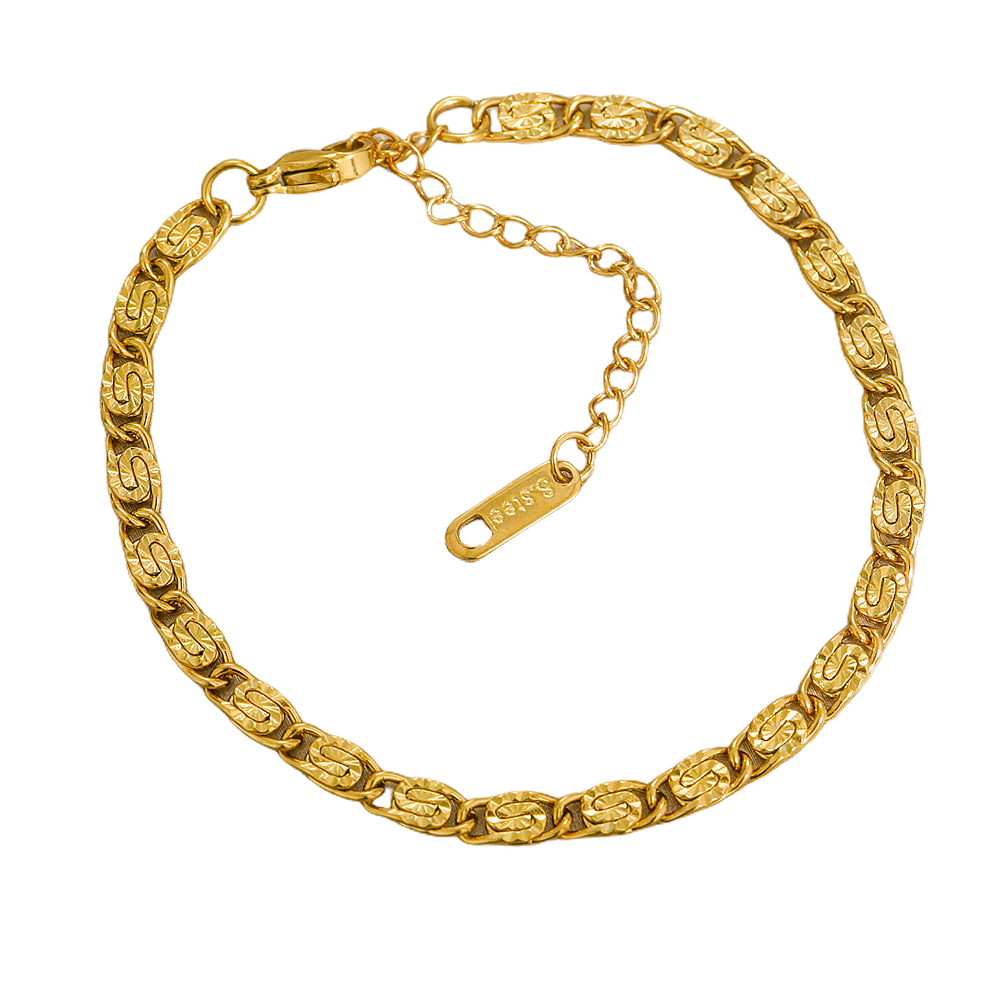 Gold stainless steel chain bracelet on a white background
