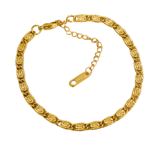 Gold stainless steel chain bracelet on a white background